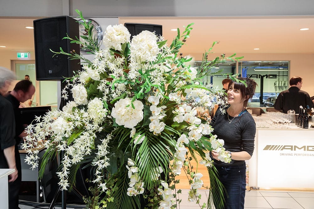 Kim creating the floral arrangements for the AMG Showroom Launch