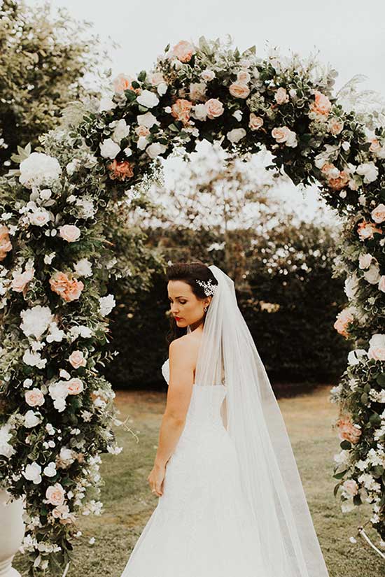 Beautiful bride with her wedding arch