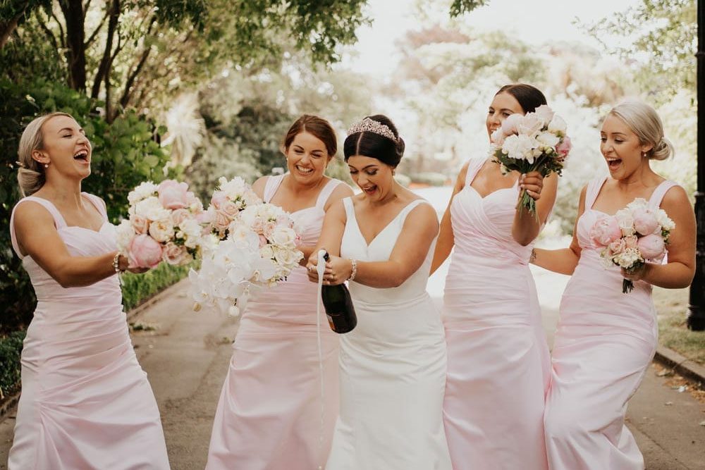 Beautiful bride and bridesmaids with their bouquets